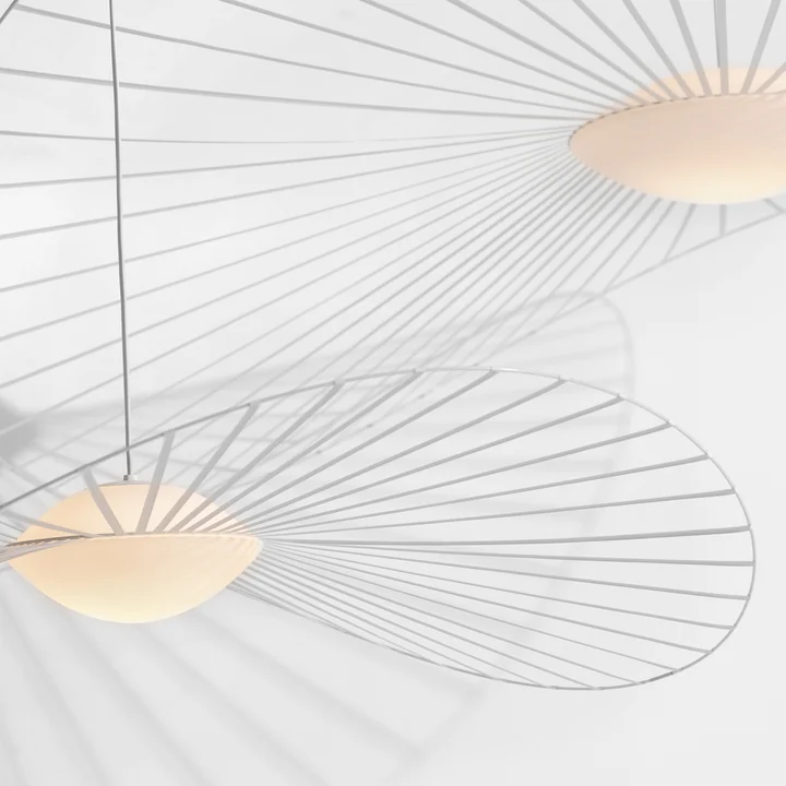 The Vertigo Nova pendant lamp from Petite Friture in white with its luminous glass sphere and thin rods
