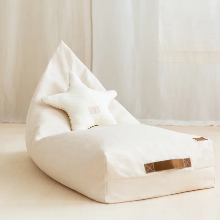 The Oasis children's beanbag from Nobodinoz in natural with a white cushion