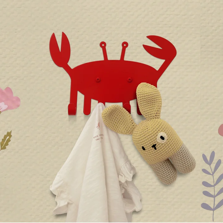 The Little Crab wall hook from vonbox with clothes and cuddly toy in the children's room