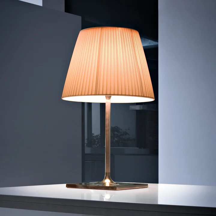 The K Tribe T2 table lamp from Flos with fabric shade on a white table