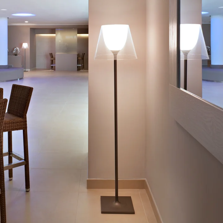The K Tribe F2 floor lamp from Flos with transparent shade in a large lobby