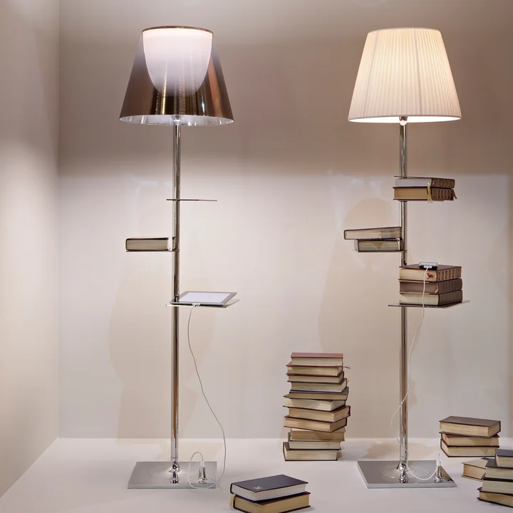 The shining Bibliotheque Nationale floor lamp from Flos surrounded by books