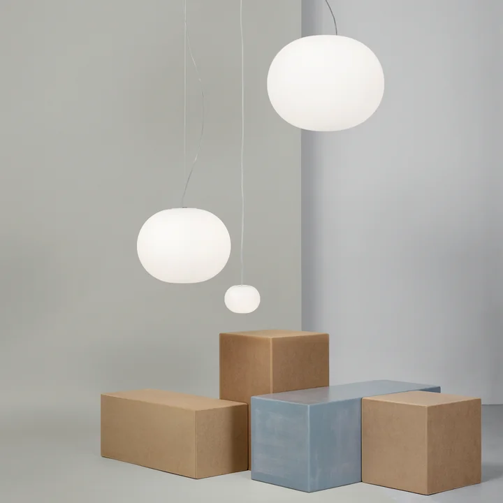 The Glo Ball pendant lights from Flos with their voluminous glass sphere