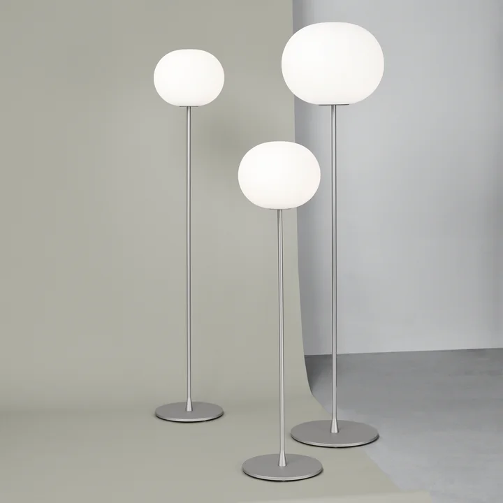 The Glo Ball floor lamps from Flos in silver matt in their different sizes