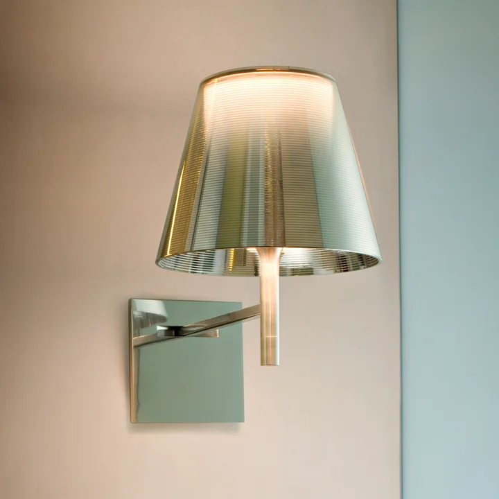 The K Tribe wall light from Flos combines clear lines and futuristic materials