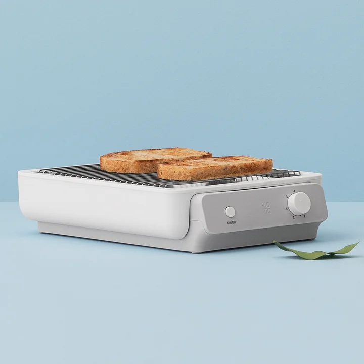 The Foodie flat toaster from Rig-Tig by Stelton in white with two toast slices