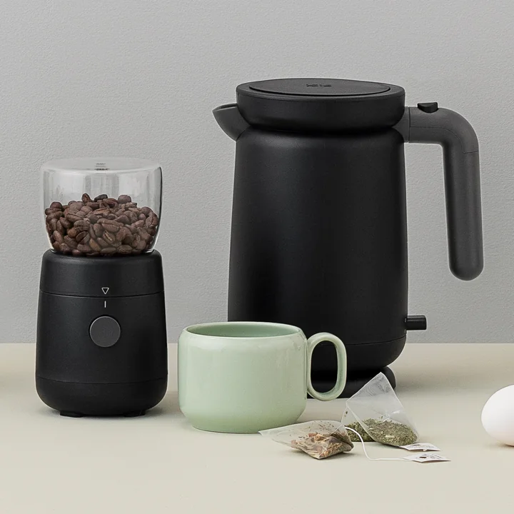 The ultra-modern Foodie coffee grinder and kettle from Rig-Tig by Stelton in black