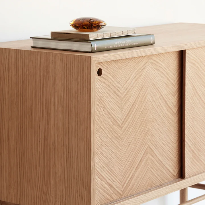 Sideboard with sliding doors and stylish wooden details