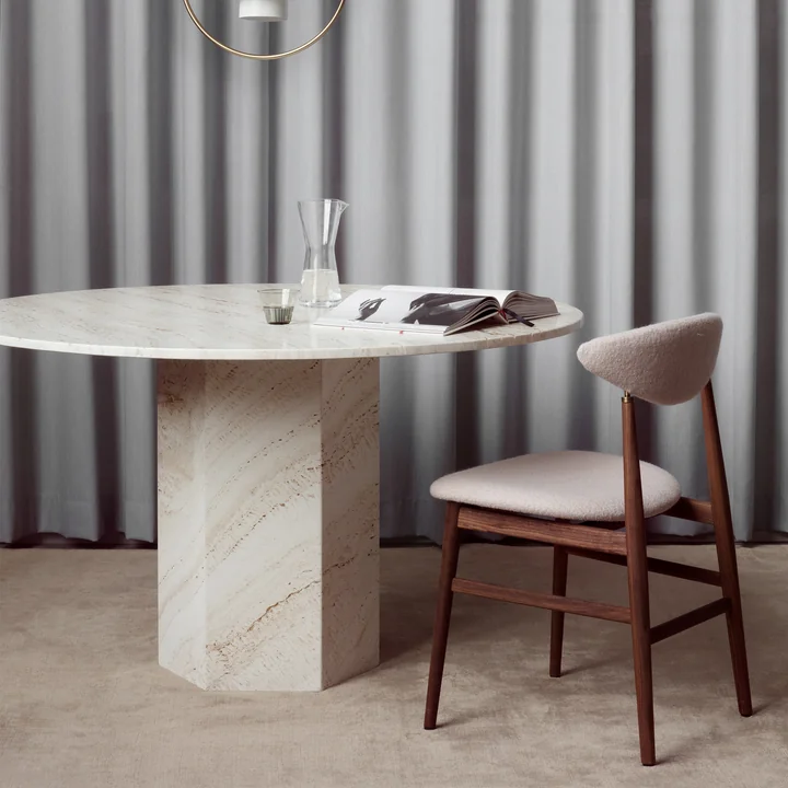 Stylish stone dining table in classic ambience