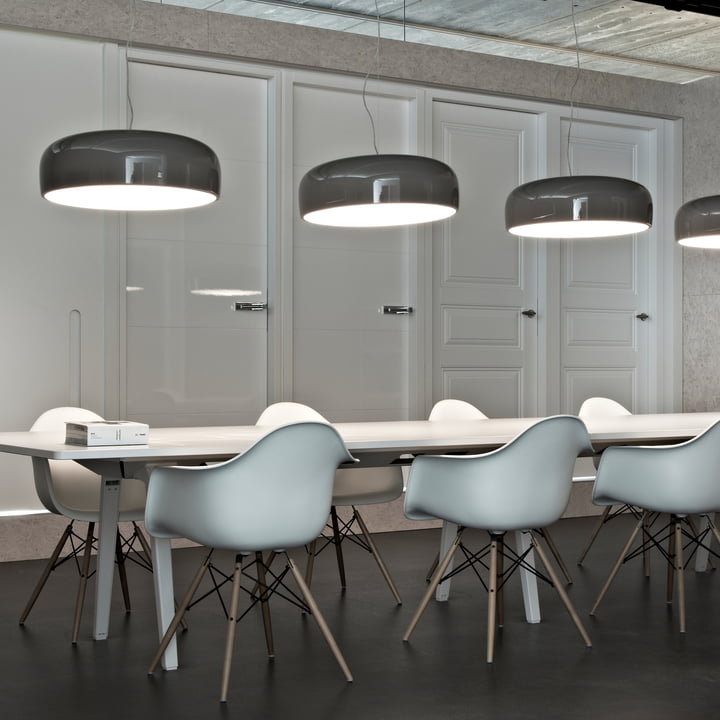 The Smithfield Pro pendant lights from Flos above a long, white conference table