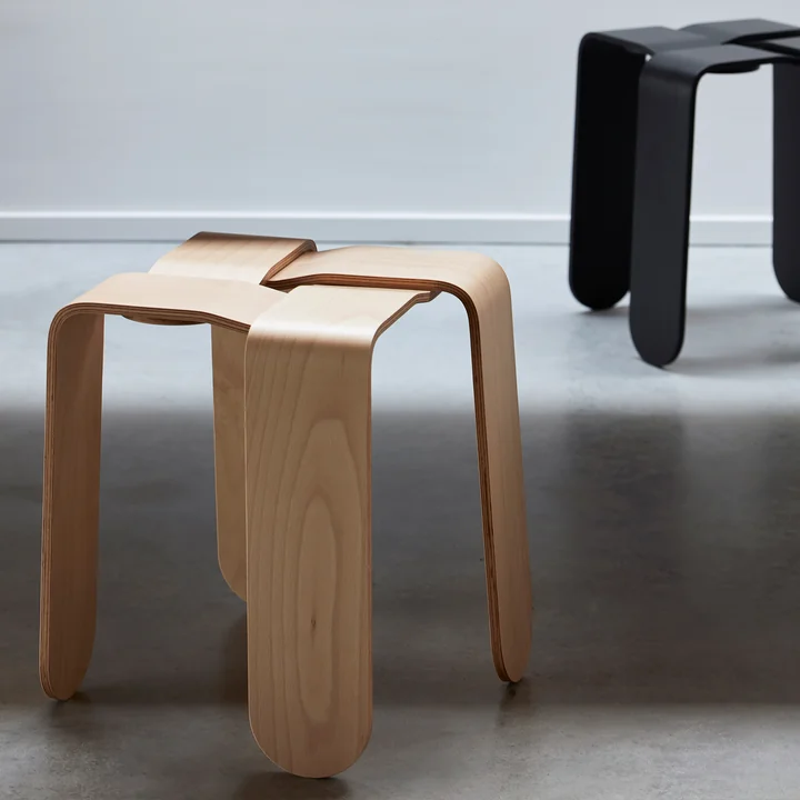 The Criss Cross stools from Frederik Roijé in natural beech and dark grey can be combined with each other