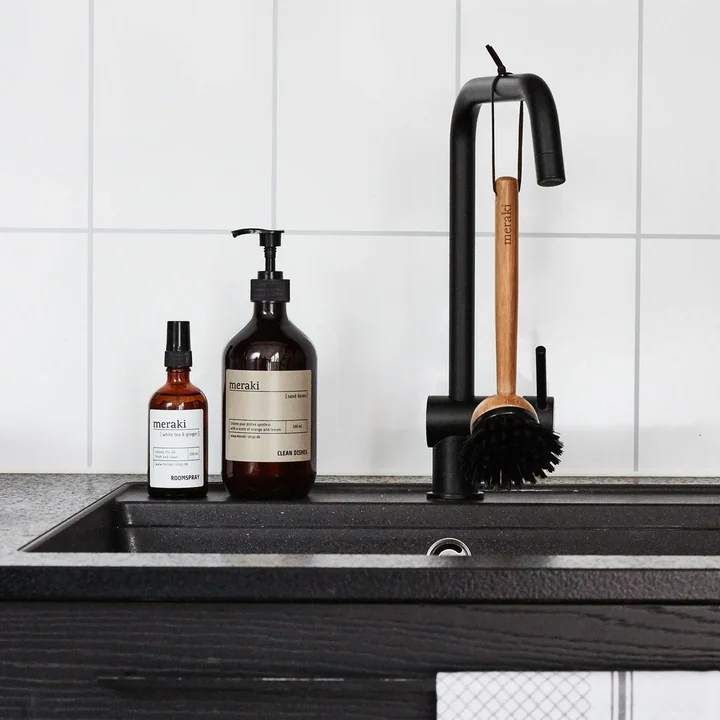 The dishwashing brush from Meraki hung on the tap above the sink in the kitchen