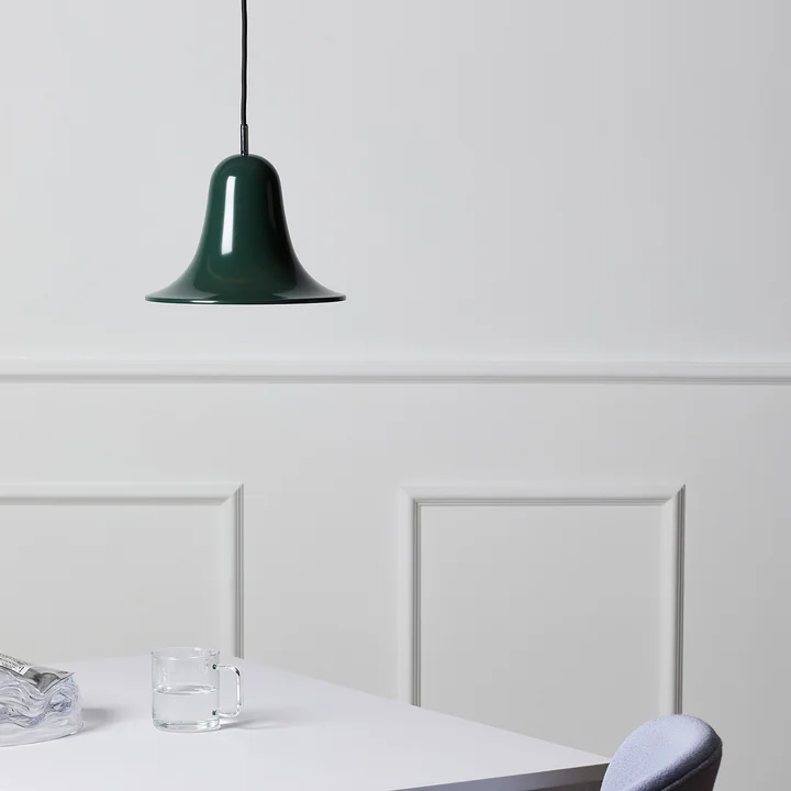 The dark green Pantop pendant lamp from Verpan over a dining table