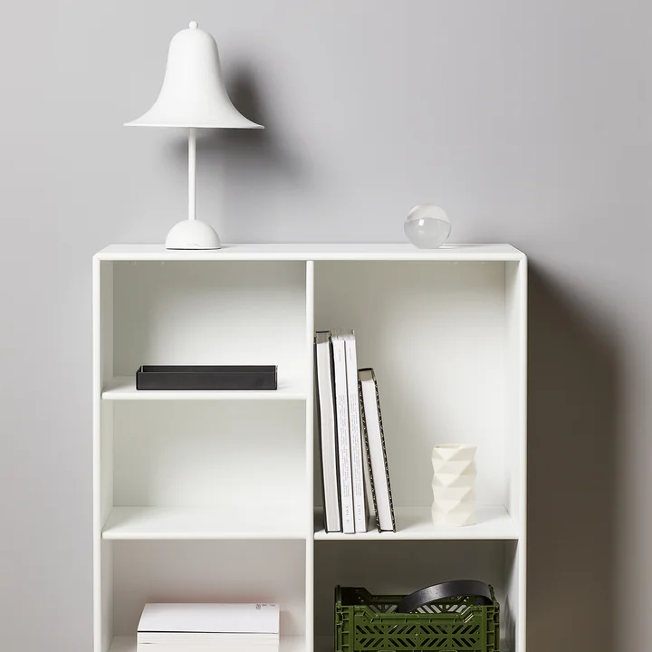 The Pantop table lamp from Verpan in white on a bookshelf