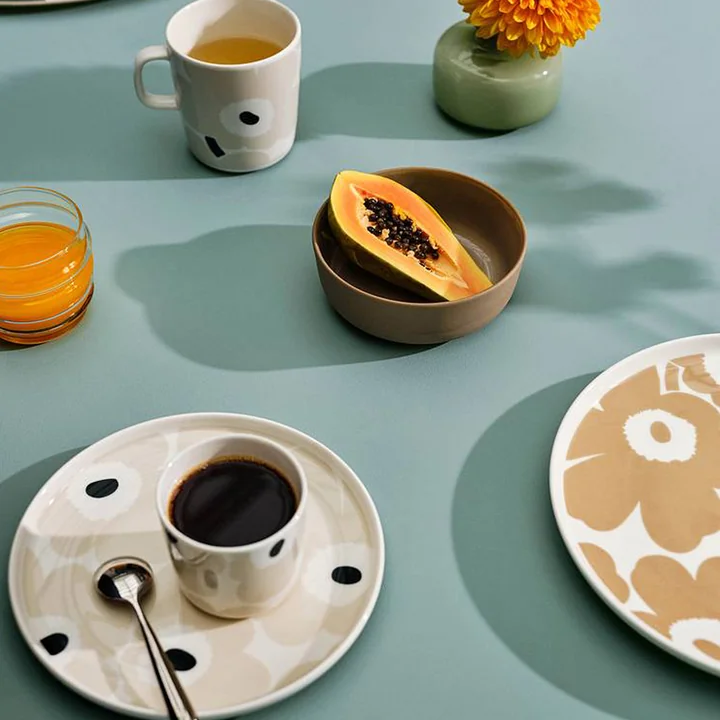 Marimekko s Unikko poppy pattern on plates in beige and white