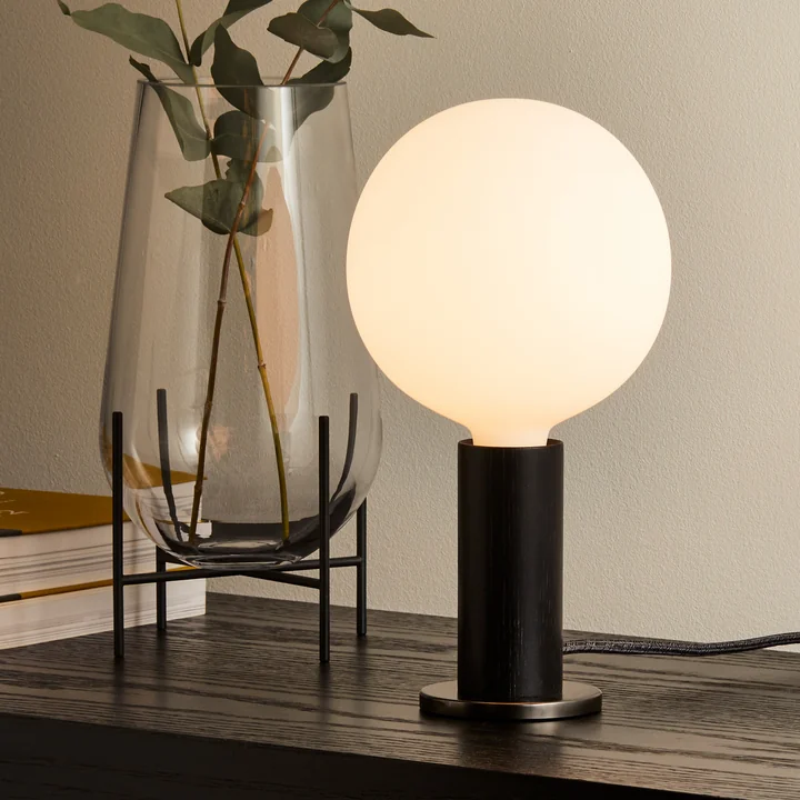 Atmospheric and compact table lamp for the whole house