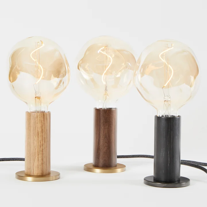 Stylish compact designer lamp in different variations