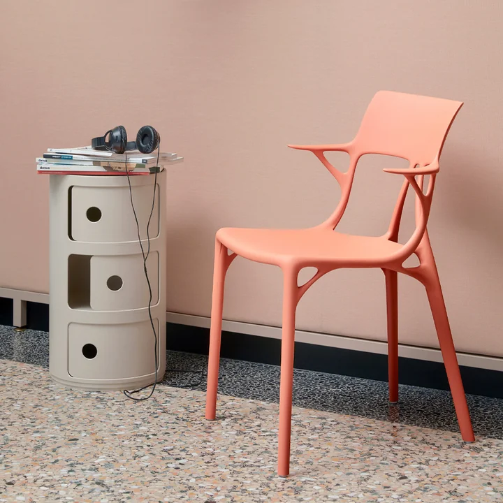 The Componibili Bio 5970 from Kartell next to a salmon-coloured chair