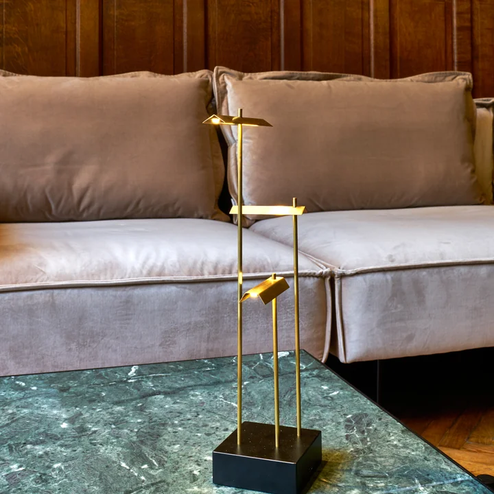 The Knokke rechargeable LED table lamp from DCW on a stylish coffee table in the living room