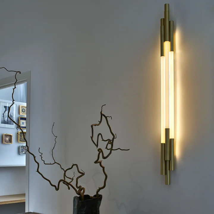 The Org LED wall lamp from DCW vertical on a white wall