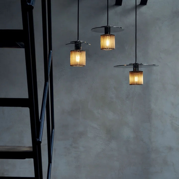 The In the Sun pendant luminaire from DCW in a dark atmosphere
