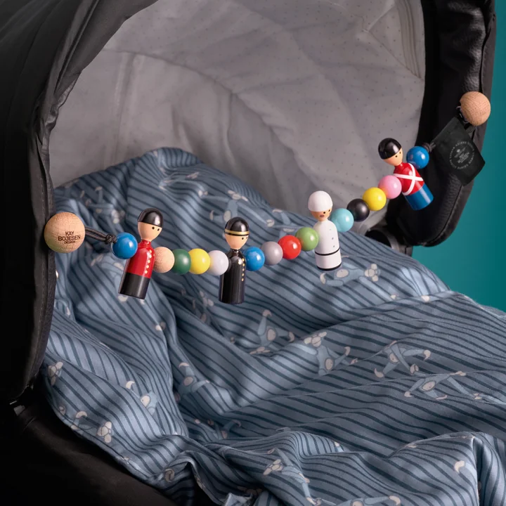 The loving wooden chain on the pram