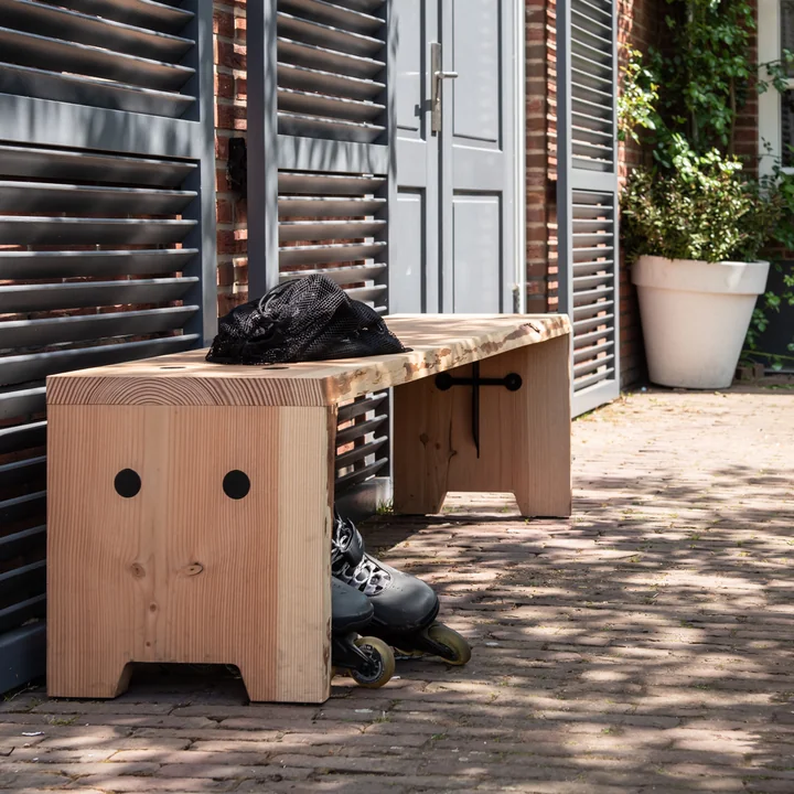 The Forestry bench from Weltevree outside on the house wall