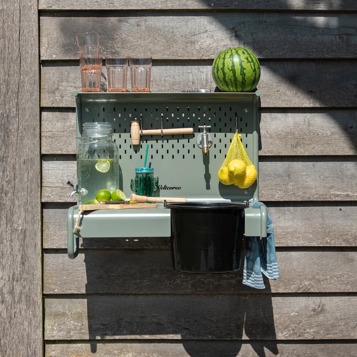 The Waterworks storage table for faucet from Weltevree with refreshing drinks and lemons