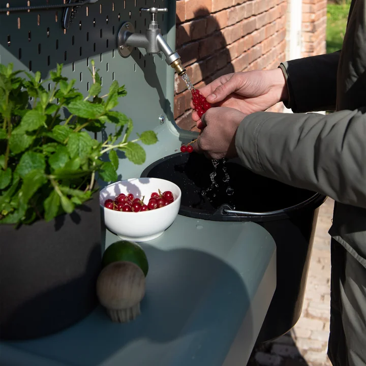 The Waterworks storage table for faucet from Weltevree for washing fruit from the garden