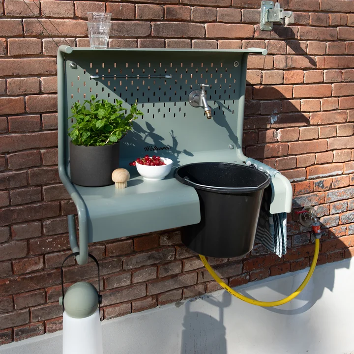 The Waterworks storage table from Weltevree with herbs, fruits and glasses