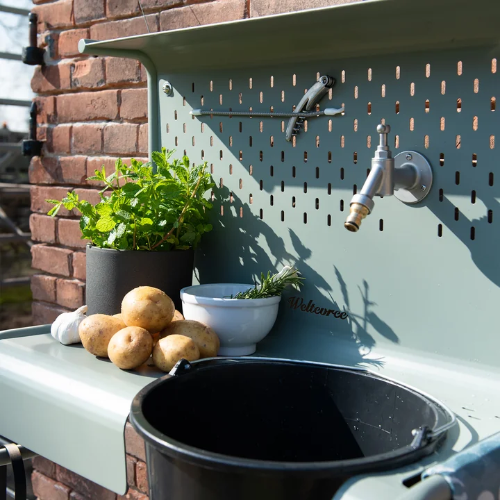 The Waterworks storage table for faucet from Weltevree with potatoes and herbs