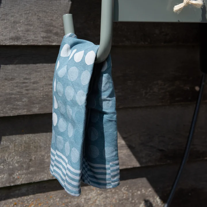 The blue tea towel on the Waterworks storage table from Weltevree e