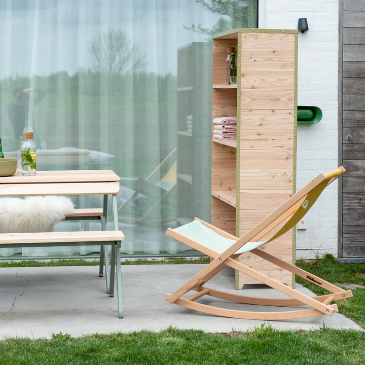 The Beach Rocker rocking chair from Weltevree on the terrace next to other garden furniture