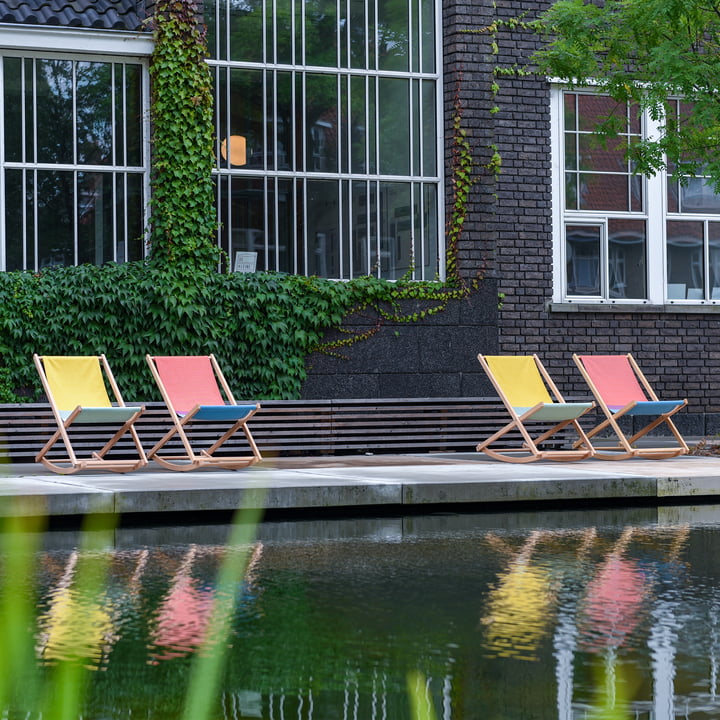 The Beach Rocker rocking chairs from Weltevree in their different colours at the pond