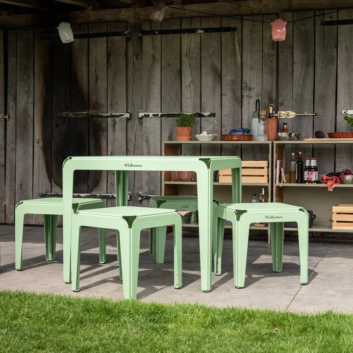 The products in the Bended series from Weltevree outside in front of a wooden shed