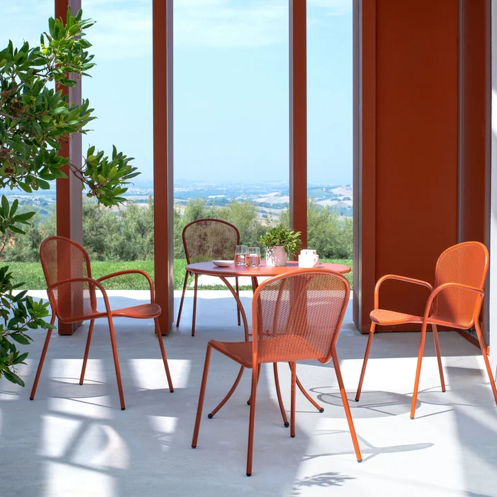 The Ronda XS chairs from Emu in front of a large window front.