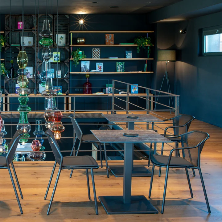 The Darwin garden chair and armchair from Emu in a restaurant