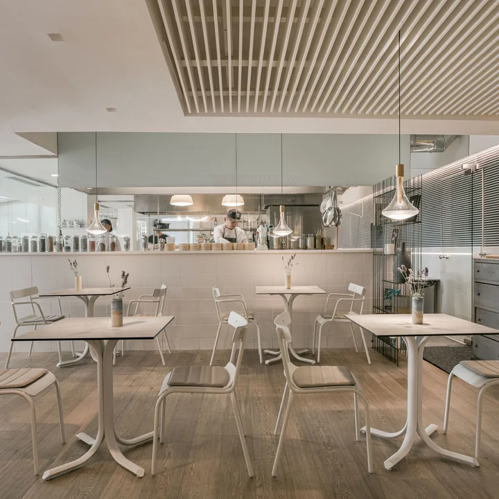 The Miky garden chair and Miky Armchair from Emu in a restaurant