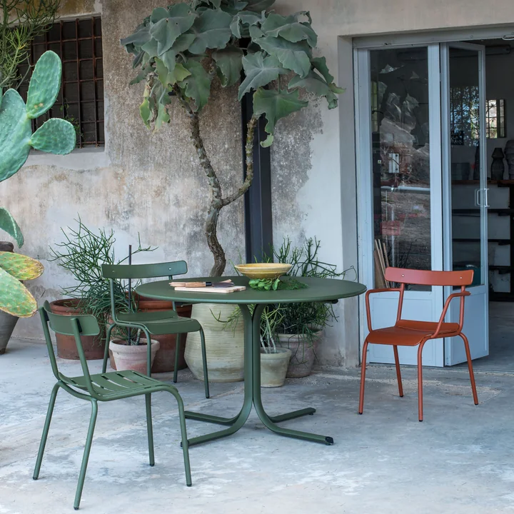 The Miky garden chair and the Miky armchair from Emu on a terrace