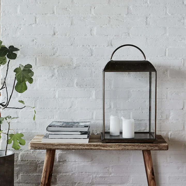 The short Nadi bench from House Doctor with books and a lantern