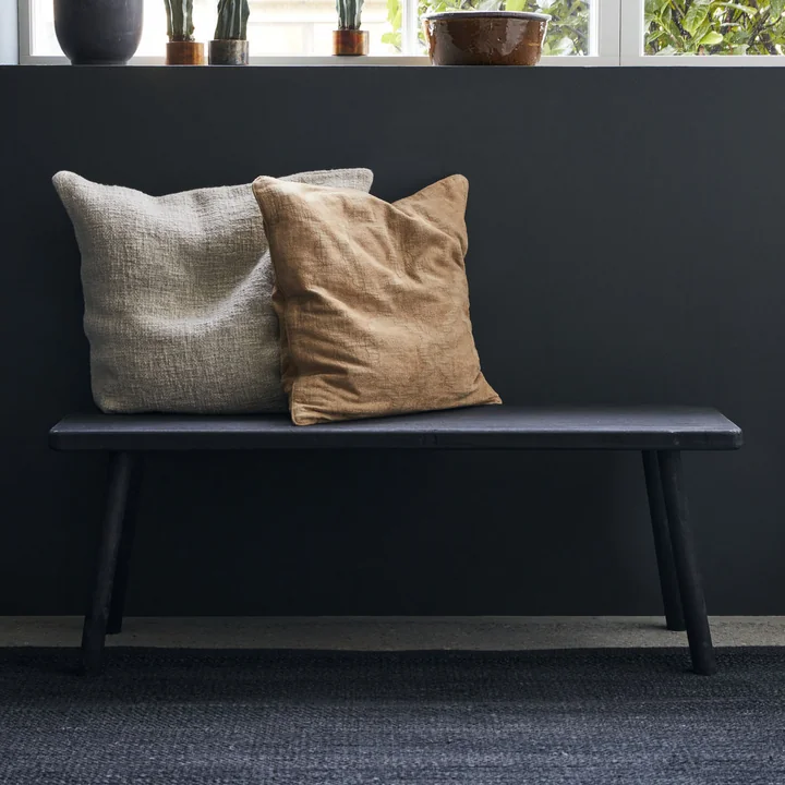 The black Nadi bench from House Doctor with cushion under the window