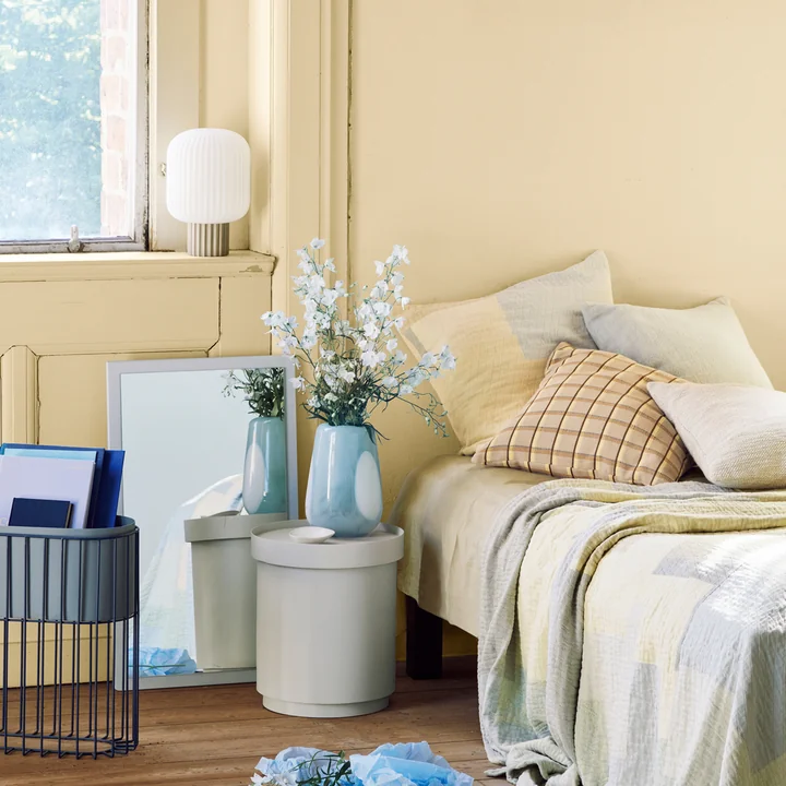 The Ada Dot vase on the Ninna side table from Broste Copenhagen in the bedroom