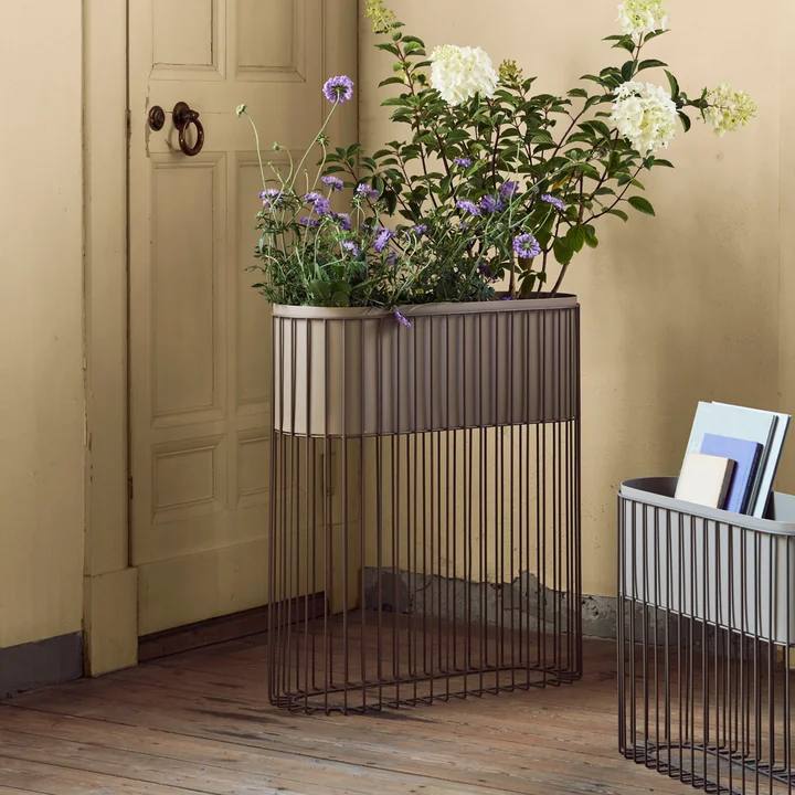 The Fenja rack with planter from Broste Copenhagen with flowers and books