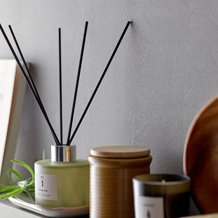 The ILLUME diffuser from Bloomingville next to scented candles and home accessories