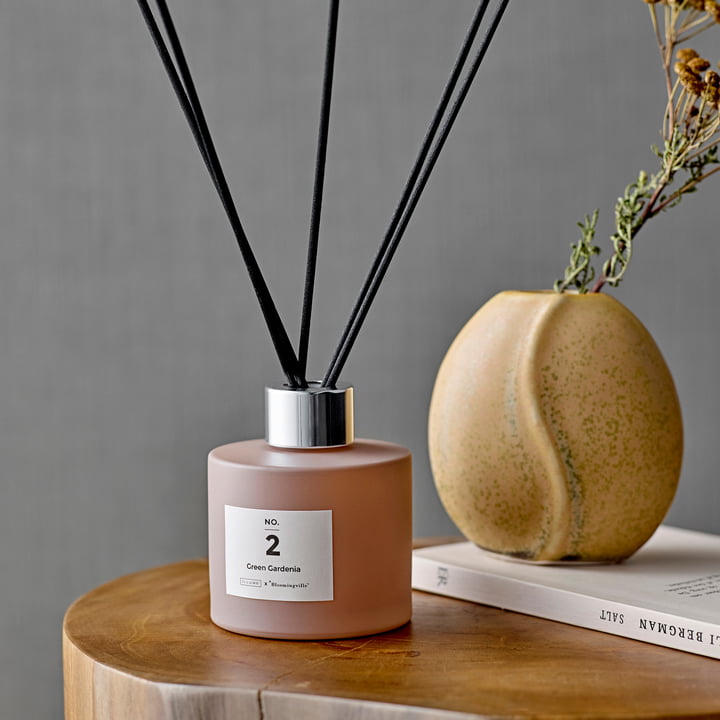 The ILLUME diffuser from Bloomingville on a wooden side table