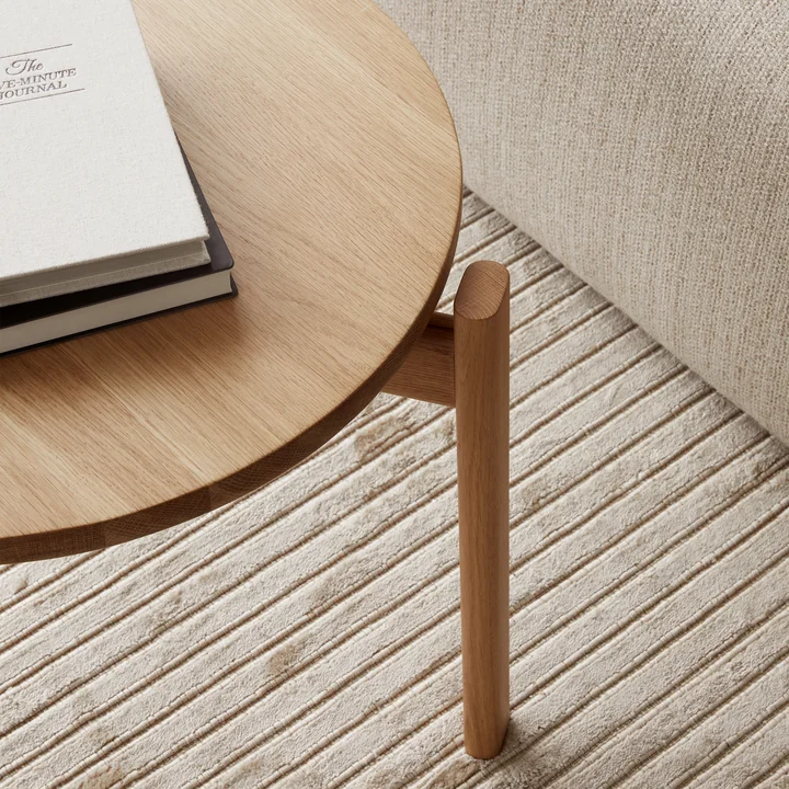 The Passage Lounge table from Audo serves as a shelf for books and drinks