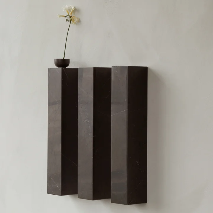 The vertical Plinth shelf from Audo as a hanging podium