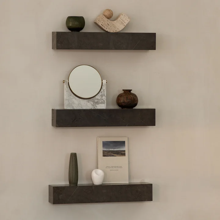 Several Plinth shelves from Audo on the wall