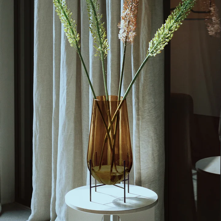 The Échasse Vase L from Audo on a side table