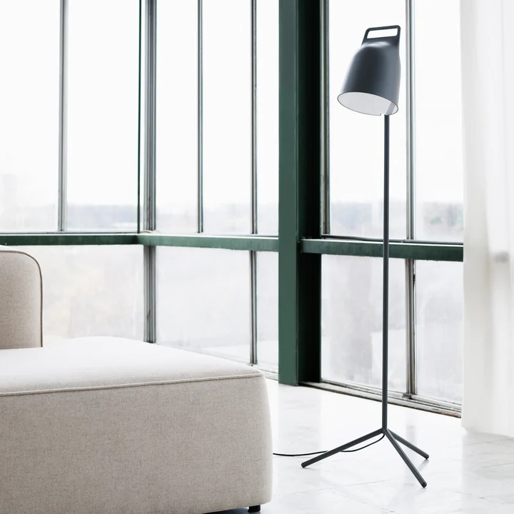The Stage LED floor lamp from Normann Copenhagen in front of a window frontage